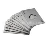 Metal playing cards with spade symbols and cutout spade design on the top card, used for promotional or gaming events.