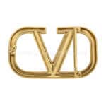 Shiny gold-tone metal belt buckle with interlocking initials V and D, stylish accessory for custom promotional products.