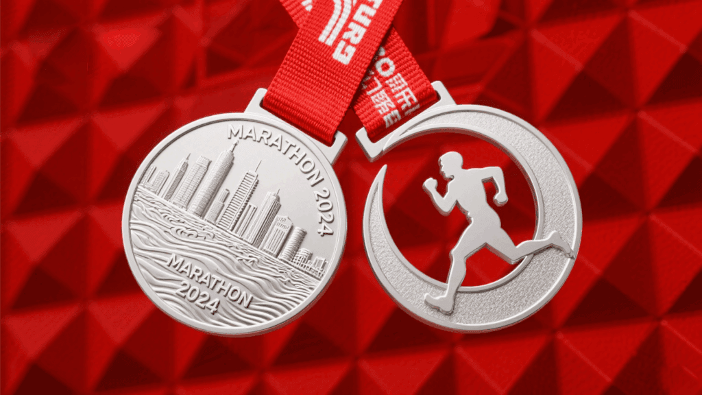 Silver marathon medal with city skyline design and red ribbon, perfect for race awards.