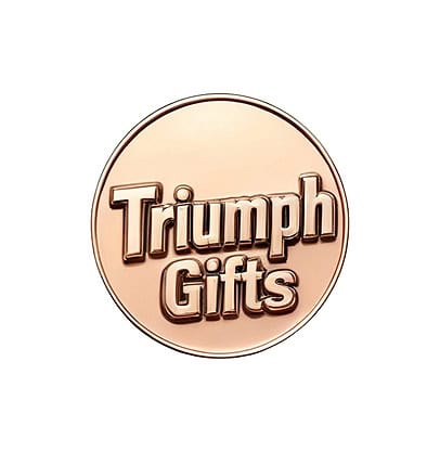Shiny bronze Triumph Gifts logo medal with engraved text, representing custom promotional products, trophies, and medals manufacturing services.