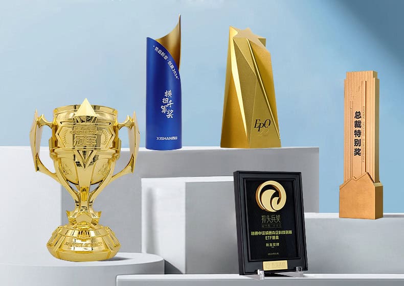 Elegant gold trophy and custom awards displayed on white pedestals, showcasing high-quality trophies, medals, and personalized promotional products for corporate recognition and special achievements.