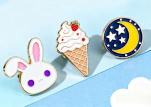 Cute bunny, ice cream cone, and moon and star themed enamel pins for custom promotional products, trophies, and medals, perfect for awards and personalized gifts from TriumphGifts.