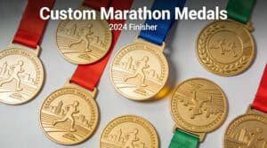 Medals for marathon winners with engraved running figures and cityscape design.