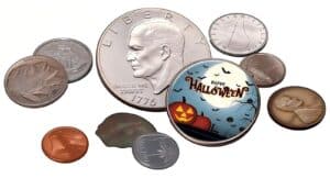 Assorted Halloween-themed coins and medals, including a decorative button with a Halloween design, perfect for promotional giveaways during Halloween events.