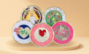 Collection of custom promotional coins and medals featuring various designs including religious, motivational, and corporate themes. Perfect for branding and recognition.